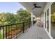 Expansive outdoor deck with ceiling fan and views of mature landscaping at 2213 Rolling Dune Rd, Seabrook Island, SC 29455