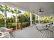 Relaxing outdoor deck with comfortable seating, a hammock, and lush greenery at 2213 Rolling Dune Rd, Seabrook Island, SC 29455