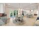 Bright dining room with hardwood floors and a crystal chandelier open to the kitchen at 2213 Rolling Dune Rd, Seabrook Island, SC 29455