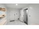Bright entryway features white shiplap walls, tile flooring, built-in shelving, and a residential elevator at 2213 Rolling Dune Rd, Seabrook Island, SC 29455