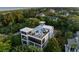 Stunning three-story home featuring a rooftop deck with ocean views and outdoor seating at 2213 Rolling Dune Rd, Seabrook Island, SC 29455