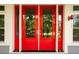 Stunning red double front doors create a grand entrance to this home at 2213 Rolling Dune Rd, Seabrook Island, SC 29455