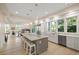 Bright eat-in kitchen with island, stainless steel appliances, and hardwood floors at 2213 Rolling Dune Rd, Seabrook Island, SC 29455