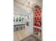 Modern kitchen with a large island, hardwood floors, and stainless steel appliances at 2213 Rolling Dune Rd, Seabrook Island, SC 29455