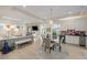Open-concept living and dining area with hardwood floors, a fireplace, and built-in shelving at 2213 Rolling Dune Rd, Seabrook Island, SC 29455