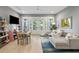 Bright living room with comfortable seating, stylish decor, and natural light from the balcony access at 2213 Rolling Dune Rd, Seabrook Island, SC 29455