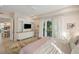 Bright main bedroom featuring access to a private balcony and an entertainment center at 2213 Rolling Dune Rd, Seabrook Island, SC 29455