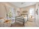 Charming bedroom with white curtains, French doors leading to a balcony, and cozy decor at 2213 Rolling Dune Rd, Seabrook Island, SC 29455