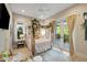 Serene main bedroom boasts a canopy bed and private balcony access with natural light and outdoor views at 2213 Rolling Dune Rd, Seabrook Island, SC 29455