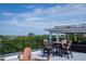 Relax and entertain on this rooftop deck with dining area and ocean view at 2213 Rolling Dune Rd, Seabrook Island, SC 29455