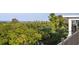 Enjoy the scenery from the porch, taking in the views of lush greenery and blue water at 2213 Rolling Dune Rd, Seabrook Island, SC 29455