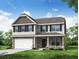 Charming two-story home with stone accents, a covered porch, and a two-car garage at 222 Palfrey Dr, Ridgeville, SC 29472