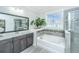 Relax in this bathroom's soaking tub and separate glass shower at 2234 Mother Of Pearl Dr, Mount Pleasant, SC 29466