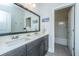 This bathroom has dual sinks with dark cabinets at 2234 Mother Of Pearl Dr, Mount Pleasant, SC 29466