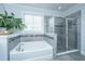 This bathroom features a soaking tub and a separate glass shower at 2234 Mother Of Pearl Dr, Mount Pleasant, SC 29466