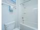 Bright bathroom featuring a shower-tub combo with white tile surround, accented by calming beach-themed decor at 2234 Mother Of Pearl Dr, Mount Pleasant, SC 29466