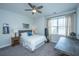 Cozy bedroom with neutral tones, complemented by a ceiling fan, decorative medals and a unique accent punching bag at 2234 Mother Of Pearl Dr, Mount Pleasant, SC 29466