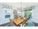 Cozy dining area featuring a wooden table, wicker chairs, and access to an outdoor patio at 2234 Mother Of Pearl Dr, Mount Pleasant, SC 29466