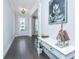 Welcoming entryway featuring dark wood floors, a white console table, and elegant decor at 2234 Mother Of Pearl Dr, Mount Pleasant, SC 29466