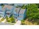 Beautiful two-story home with a covered porch, mature trees, a well-manicured lawn, and a garage at 2234 Mother Of Pearl Dr, Mount Pleasant, SC 29466