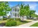 Charming two-story home with double porches and a well-manicured lawn and landscaping at 2234 Mother Of Pearl Dr, Mount Pleasant, SC 29466