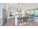 Beautiful kitchen featuring gray cabinets, stainless steel appliances, and a spacious island with bar seating at 2234 Mother Of Pearl Dr, Mount Pleasant, SC 29466