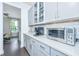 Well-lit kitchen featuring modern appliances, white subway tile backsplash, and elegant gray cabinetry at 2234 Mother Of Pearl Dr, Mount Pleasant, SC 29466