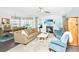 Open-concept living area with a fireplace and an adjacent dining area, perfect for entertaining at 2234 Mother Of Pearl Dr, Mount Pleasant, SC 29466