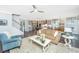 Bright living room showing stairs, kitchen, and dining area, creating an open living space at 2234 Mother Of Pearl Dr, Mount Pleasant, SC 29466