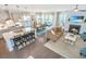 Open-concept living space with kitchen, dining, and living areas featuring hardwood floors at 2234 Mother Of Pearl Dr, Mount Pleasant, SC 29466