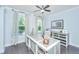 Bright home office featuring a large desk, natural light, and neutral decor at 2234 Mother Of Pearl Dr, Mount Pleasant, SC 29466