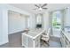 Bright home office featuring a large desk, natural light, and neutral decor at 2234 Mother Of Pearl Dr, Mount Pleasant, SC 29466