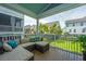 Relaxing screened patio with a comfortable sectional sofa, providing a perfect view of the fenced backyard at 2234 Mother Of Pearl Dr, Mount Pleasant, SC 29466