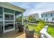 Charming patio with wicker seating and a view of the lush backyard, perfect for outdoor relaxation and entertaining at 2234 Mother Of Pearl Dr, Mount Pleasant, SC 29466