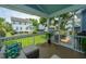 Inviting screened patio with a cozy sofa and a view of the manicured lawn and neighborhood houses at 2234 Mother Of Pearl Dr, Mount Pleasant, SC 29466