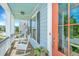 Inviting front porch with rocking chairs and a charming view of the neighborhood at 2234 Mother Of Pearl Dr, Mount Pleasant, SC 29466