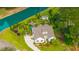 Stunning aerial view of the home with lush landscaping, a lovely garden, and a serene waterfront at 225 Camber Rd, Huger, SC 29450