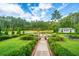 Beautiful backyard featuring a water feature, manicured landscaping, and serene views; perfect for relaxation at 225 Camber Rd, Huger, SC 29450
