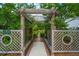 Lush garden arbor featuring mature trees and seating at 225 Camber Rd, Huger, SC 29450