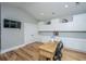 Bright home office with custom cabinets, hardwood floors, and modern lighting; ideal for remote work and creative projects at 225 Camber Rd, Huger, SC 29450
