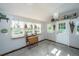 Light-filled shed features three windows and a drop leaf table for gardening at 225 Camber Rd, Huger, SC 29450