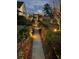 Illuminated garden walkway with lush greenery at 225 Camber Rd, Huger, SC 29450