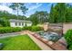 Backyard water feature with mature trees at 225 Camber Rd, Huger, SC 29450