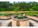 Elegant water fountain set within a beautifully landscaped garden; a focal point of tranquility and beauty at 225 Camber Rd, Huger, SC 29450