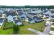 Aerial view of a residential neighborhood showcasing well-maintained homes, green spaces, and a well-planned community at 238 Bird Song Path, Summerville, SC 29485