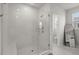 Beautifully tiled walk-in shower featuring a glass enclosure and modern fixtures in primary bathroom at 238 Bird Song Path, Summerville, SC 29485