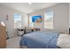 Well-lit bedroom featuring large windows, and custom desk, perfect for a comfortable workspace at 238 Bird Song Path, Summerville, SC 29485