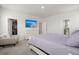 Bright bedroom featuring a large TV, light-colored walls, carpet and an open closet at 238 Bird Song Path, Summerville, SC 29485