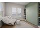 Versatile room with built-in shelves, Murphy bed, and cozy lounge chair at 238 Bird Song Path, Summerville, SC 29485
