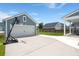 Long driveway leading to a detached garage with a basketball hoop in this outdoor space at 238 Bird Song Path, Summerville, SC 29485